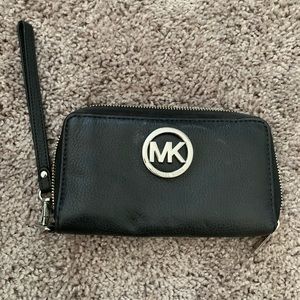 Small black MK clutch.